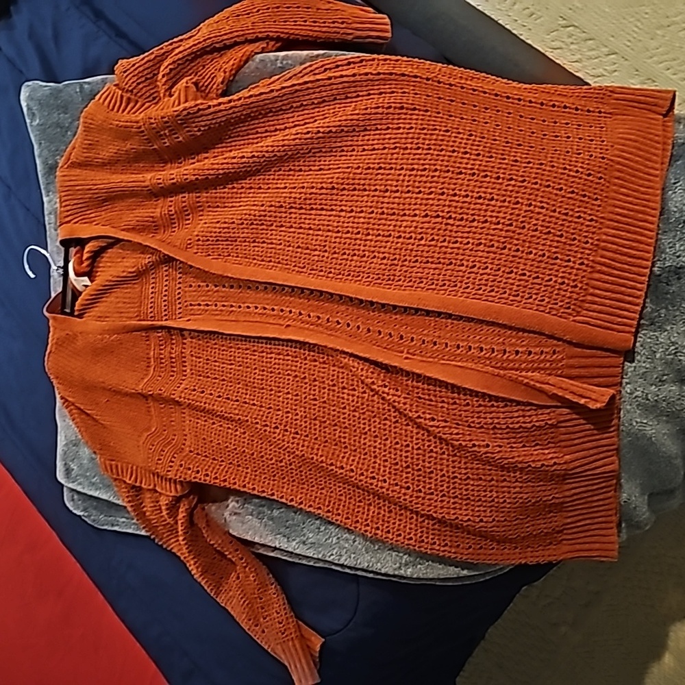 An orange cardigan